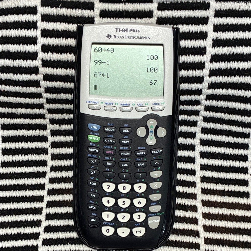 Texas Instruments TI-84 Plus Graphing Calculator - Black and Gray